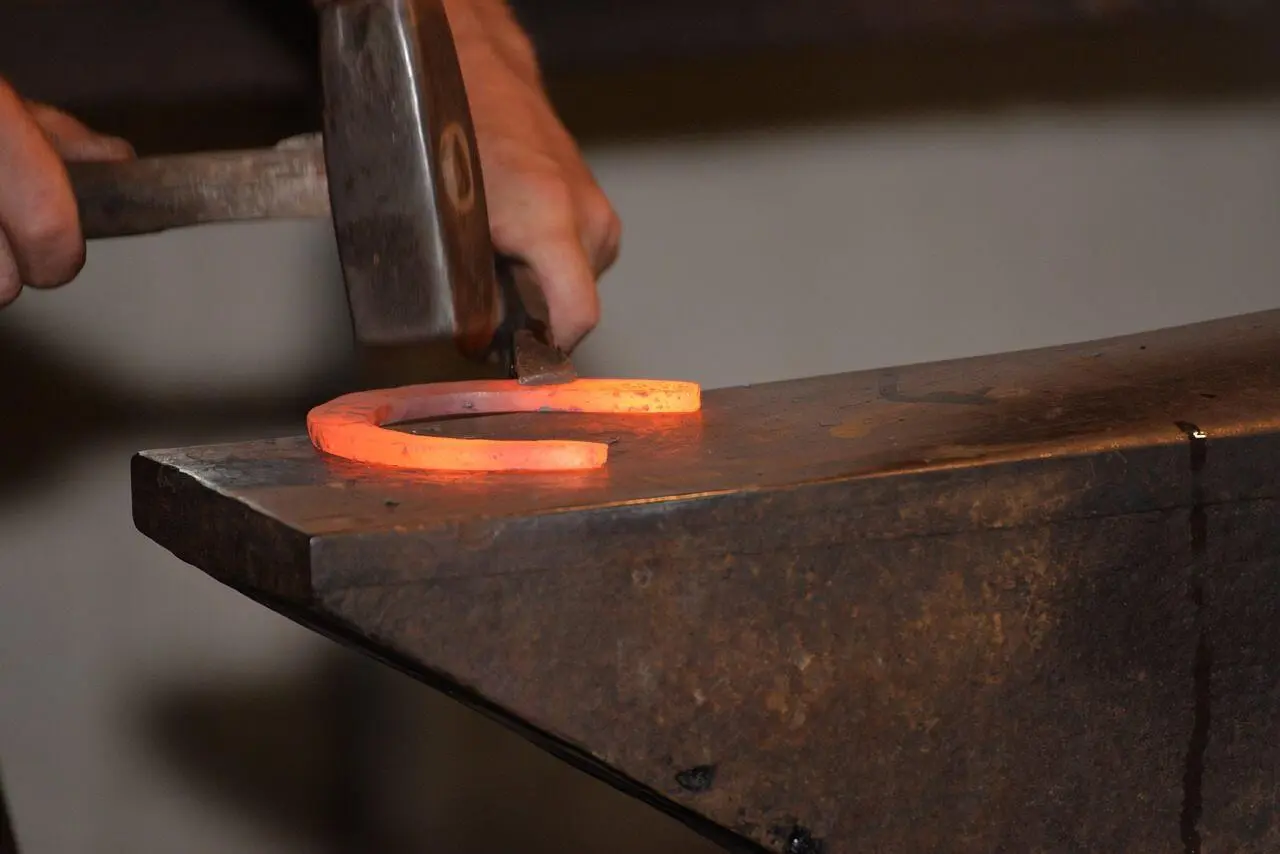 Fig 123 Two of Disks A blacksmith forging a horseshoe The hammer striking - фото 20