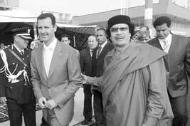 Президент Сирии Башар Асад и Муаммар Каддафи Еще в декабре 2010 года США - фото 84